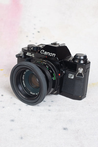 Canon AL-1 Black SLR 35mm Film Camera + Canon FD 50mm f/2 Lens - Clothing and Home Goods in Los Angeles - Virgil Normal 
