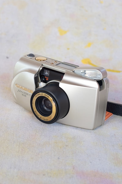 Olympus μ mju Zoom 115 Deluxe 38-115mm Gold Point & Shoot Film Camera - Clothing and Home Goods in Los Angeles - Virgil Normal 