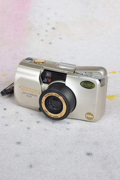 Olympus MJU 105 Zoom Camera - Gold - Clothing and Home Goods in Los Angeles - Virgil Normal 
